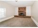 Spacious living room featuring a classic brick fireplace, neutral walls, and carpet at 2914 Landmark Se Dr, Conyers, GA 30094