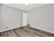 Bedroom with wood-look floors and a doorway to another room at 3117 Calumet Nw Cir, Kennesaw, GA 30152