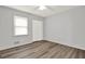 Cozy bedroom with wood-look floors, a ceiling fan, and a window with blinds at 3117 Calumet Nw Cir, Kennesaw, GA 30152