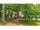 The inviting entrance is enhanced by a charming deck, framed by mature trees and natural landscaping at 3117 Calumet Nw Cir, Kennesaw, GA 30152