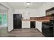 Bright kitchen with stainless steel appliances, tile backsplash, and a view to the backyard deck at 3117 Calumet Nw Cir, Kennesaw, GA 30152