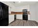 Functional kitchen with white cabinets, black appliances, and a tiled backsplash at 3117 Calumet Nw Cir, Kennesaw, GA 30152