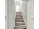 Carpeted staircase with white risers and handrails, leading to an upper level at 3117 Calumet Nw Cir, Kennesaw, GA 30152