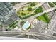 A high-angle view of a pool, streets, and building tops is featured in this aerial shot at 400 W Peachtree Nw St # 3801, Atlanta, GA 30308