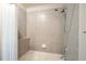 Tile bathroom featuring a shower-tub combo with detachable shower head and tiled walls at 400 W Peachtree Nw St # 3801, Atlanta, GA 30308