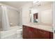 Bathroom vanity with granite countertop, tile flooring, toilet, and shower tub combo at 400 W Peachtree Nw St # 3801, Atlanta, GA 30308