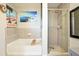 This bathroom has a shower and a bathtub at 400 W Peachtree Nw St # 3801, Atlanta, GA 30308