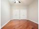 Empty bedroom with hardwood floors, ceiling fan, and two closet doors at 400 W Peachtree Nw St # 3801, Atlanta, GA 30308