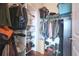 Walk-in closet with shelving and hanging storage for clothing and accessories at 400 W Peachtree Nw St # 3801, Atlanta, GA 30308