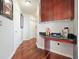 Hallway features hardwood floors and a wet bar with granite countertop and wood cabinets at 400 W Peachtree Nw St # 3801, Atlanta, GA 30308