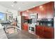 Well-lit kitchen boasts dark cabinets, granite countertops, and stainless steel appliances at 400 W Peachtree Nw St # 3801, Atlanta, GA 30308