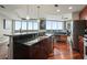 Sleek kitchen with an island, dark cabinets, stainless steel appliances, and open layout at 400 W Peachtree Nw St # 3801, Atlanta, GA 30308