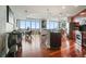 Bright, open kitchen and dining area with cherry wood floors and stainless appliances at 400 W Peachtree Nw St # 3801, Atlanta, GA 30308