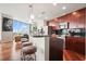 Modern kitchen with a large island, bar seating, stainless steel appliances, and cherry wood cabinets at 400 W Peachtree Nw St # 3801, Atlanta, GA 30308