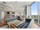 Spacious living room with expansive windows, modern furniture, and a layout that seamlessly connects to other areas at 400 W Peachtree Nw St # 3801, Atlanta, GA 30308