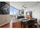 Modern living room boasts floor-to-ceiling windows with city views, a sleek black sofa, and unique decor at 400 W Peachtree Nw St # 3801, Atlanta, GA 30308