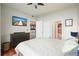 Comfortable bedroom featuring a dresser, bedside tables, and ensuite bathroom entrances at 400 W Peachtree Nw St # 3801, Atlanta, GA 30308