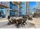 Modern outdoor patio area with plush lounge seating, grills and fire pit for residents to enjoy at 400 W Peachtree Nw St # 3801, Atlanta, GA 30308