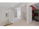 Spacious attic with carpeted floors, white trim, and access to a bedroom with bunk beds at 110 Hawks Bnd, Canton, GA 30115