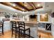 Finished basement bar with wood ceiling, custom shelving and seating at 110 Hawks Bnd, Canton, GA 30115