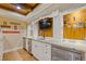 Basement wet bar area features granite countertops, a microwave, and under-counter storage at 110 Hawks Bnd, Canton, GA 30115