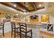 Basement bar area featuring a custom wood bar top and white cabinetry at 110 Hawks Bnd, Canton, GA 30115