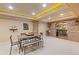 Basement game room featuring brick archway and trim, as well as a table for entertaining at 110 Hawks Bnd, Canton, GA 30115