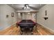 Finished basement with pool table and stairs to the upper level at 110 Hawks Bnd, Canton, GA 30115