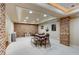 Finished basement game room with exposed brick and custom lighting at 110 Hawks Bnd, Canton, GA 30115