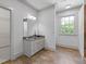 Bathroom with tile floor, vanity with granite countertop, and a sliding door to a walk-in closet at 110 Hawks Bnd, Canton, GA 30115