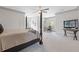 Large bedroom with four-poster bed, sitting area, desk, ceiling fan and carpeted floor at 110 Hawks Bnd, Canton, GA 30115