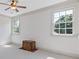 Bright bedroom with white walls, carpeted floor, and natural light from two large windows at 110 Hawks Bnd, Canton, GA 30115