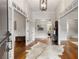 Elegant entryway boasts hardwood floors, high ceilings, and a decorative light fixture at 110 Hawks Bnd, Canton, GA 30115