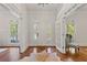 Elegant foyer with hardwood floors, bright windows, and a view to other rooms at 110 Hawks Bnd, Canton, GA 30115
