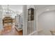 Foyer with staircase, dining area in background features hardwood floors and a chandelier at 110 Hawks Bnd, Canton, GA 30115