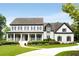 Charming two-story home with a welcoming front porch and manicured lawn, radiating curb appeal at 110 Hawks Bnd, Canton, GA 30115