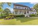 Attractive two-story home featuring a classic front porch, manicured landscaping, and a charming walkway at 110 Hawks Bnd, Canton, GA 30115