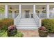 Inviting front porch with comfortable seating and decorative plants at 110 Hawks Bnd, Canton, GA 30115