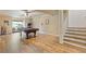 Spacious game room with hardwood floors, pool table, and adjacent stairway at 110 Hawks Bnd, Canton, GA 30115