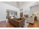 Spacious living room featuring a fireplace, hardwood floors, comfortable seating, and access to other rooms at 110 Hawks Bnd, Canton, GA 30115