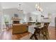 Inviting open-concept living space with hardwood floors, fireplace, and natural light at 110 Hawks Bnd, Canton, GA 30115