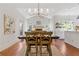Bright living area with vaulted ceiling, fireplace, and dining area at 110 Hawks Bnd, Canton, GA 30115