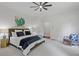 Spacious main bedroom with plush carpet, ceiling fan and ensuite bathroom access with light walls at 110 Hawks Bnd, Canton, GA 30115