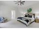 Spacious main bedroom with a ceiling fan, neutral carpet, and an attached bathroom at 110 Hawks Bnd, Canton, GA 30115