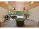 Outdoor kitchen with brick surround, ceiling fans, grill, brick flooring, and view of pool at 110 Hawks Bnd, Canton, GA 30115