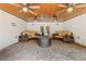 Covered patio offers comfortable seating, ceiling fans, brick flooring, and a serene outdoor retreat at 110 Hawks Bnd, Canton, GA 30115