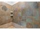 Stunning shower showcasing unique tile work and a built-in shelf for storage at 110 Hawks Bnd, Canton, GA 30115