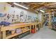 Well-lit workshop with organized tool storage, workbenches and exposed ceiling at 110 Hawks Bnd, Canton, GA 30115