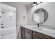 Bathroom features white quartz countertop, a modern, round mirror and walk in shower at 180 Paislee Park (Lot #9 Paislee Park) Dr, Fayetteville, GA 30215
