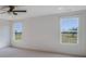 Spacious bedroom with two windows offering views of the yard, and ceiling fan at 180 Paislee Park (Lot #9 Paislee Park) Dr, Fayetteville, GA 30215